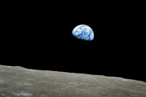 The Earth rising over the Moon's horizon, photographed from Apollo 8