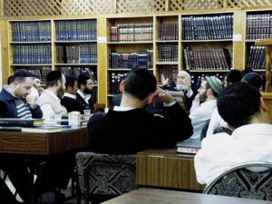 Rabbi teaching students in a Jerusalem rabbinical school