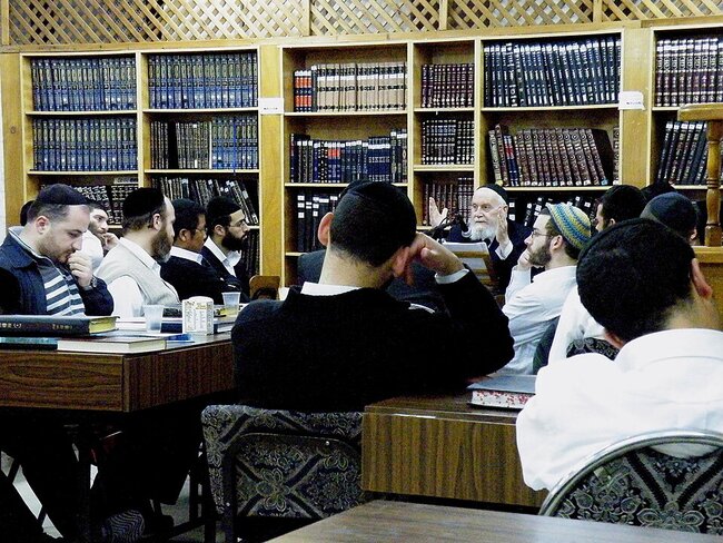Rabbi teaching students in a Jerusalem rabbinical school